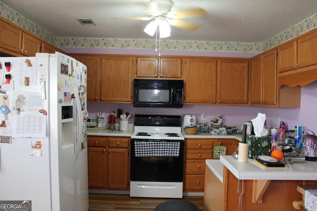 239 Ferguson Ave, Locust Grove, GA 30248 - kitchen featuring white appliances, light countertops, a ceiling fan, brown cabinets, and wallpapered walls