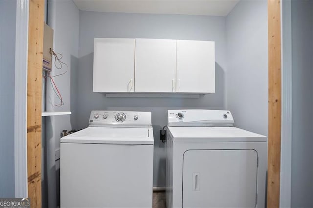 444 Polk Ln, Dallas, GA 30132 - laundry room with washing machine and clothes dryer and cabinet space