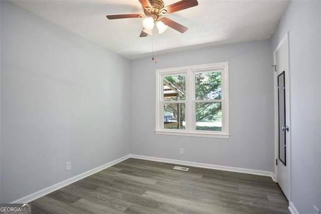 444 Polk Ln, Dallas, GA 30132 - spare room featuring wood finished floors, baseboards, and ceiling fan