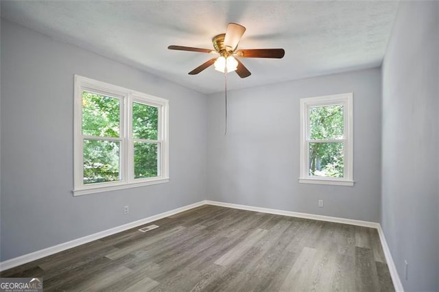 444 Polk Ln, Dallas, GA 30132 - empty room featuring ceiling fan, dark wood finished floors, and baseboards