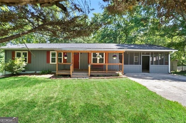 444 Polk Ln, Dallas, GA 30132 - ranch-style home featuring a sunroom, a front lawn, and concrete driveway
