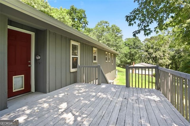444 Polk Ln, Dallas, GA 30132 - wooden deck featuring view of wooded area and a lawn