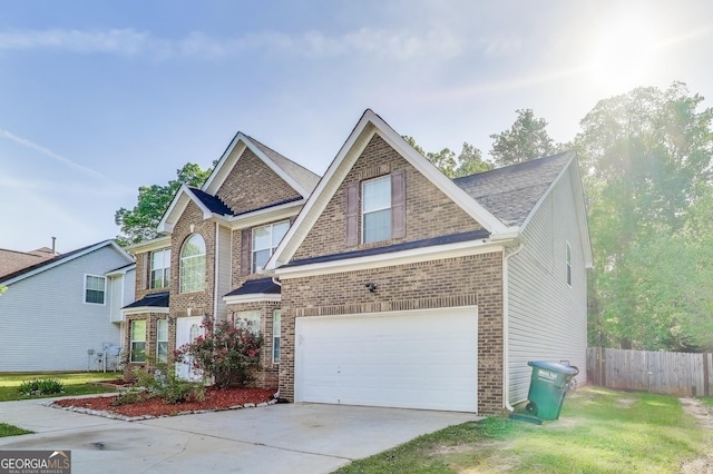 365 Othello Dr, Hampton, GA 30228 - view of front of property featuring a garage, brick siding, and concrete driveway