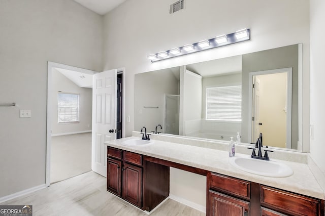 365 Othello Dr, Hampton, GA 30228 - full bathroom with a bath, double vanity, and a shower stall