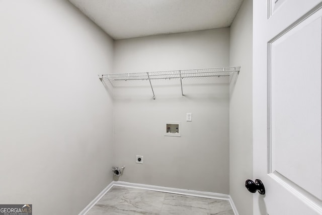365 Othello Dr, Hampton, GA 30228 - laundry room with hookup for a washing machine, electric dryer hookup, marble finish flooring, and baseboards