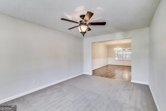 365 Othello Dr, Hampton, GA 30228 - unfurnished room featuring a chandelier, carpet flooring, ceiling fan, a textured ceiling, and baseboards