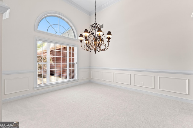 125 Lake Park Dr, Sharpsburg, GA 30277 - spare room featuring ornamental molding, a wainscoted wall, light carpet, a chandelier, and a decorative wall
