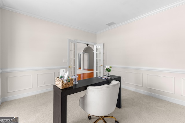 125 Lake Park Dr, Sharpsburg, GA 30277 - carpeted home office with french doors, ornamental molding, wainscoting, arched walkways, and a decorative wall