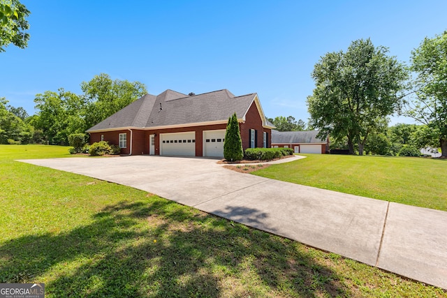 125 Lake Park Dr, Sharpsburg, GA 30277 - view of side of property with a garage, a lawn, driveway, and brick siding
