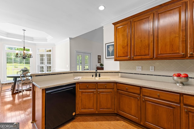 125 Lake Park Dr, Sharpsburg, GA 30277 - kitchen with black dishwasher, a sink, a chandelier, crown molding, and plenty of natural light