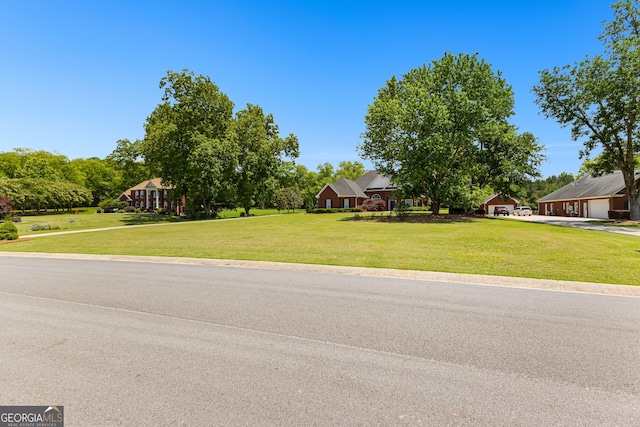 125 Lake Park Dr, Sharpsburg, GA 30277 - view of front of property with a garage, a front yard, and driveway