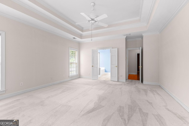 125 Lake Park Dr, Sharpsburg, GA 30277 - unfurnished bedroom with a raised ceiling, light colored carpet, crown molding, baseboards, and ensuite bathroom