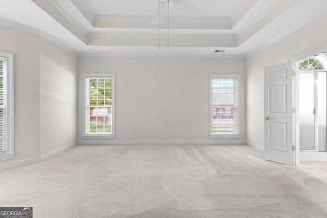 125 Lake Park Dr, Sharpsburg, GA 30277 - spare room with a raised ceiling, light colored carpet, ornamental molding, baseboards, and ceiling fan