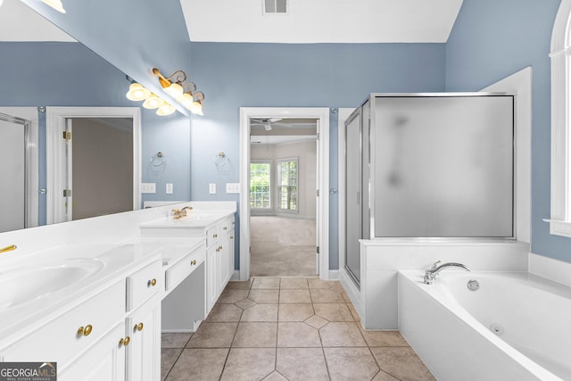 125 Lake Park Dr, Sharpsburg, GA 30277 - bathroom featuring double vanity, a stall shower, a bath, and tile patterned floors