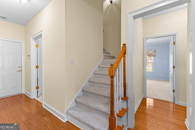 125 Lake Park Dr, Sharpsburg, GA 30277 - foyer entrance featuring wood finished floors, stairway, and baseboards