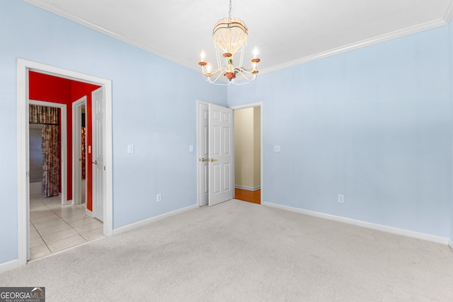125 Lake Park Dr, Sharpsburg, GA 30277 - spare room featuring carpet floors, a chandelier, ornamental molding, and baseboards
