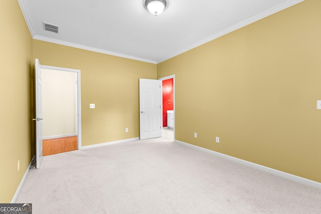 125 Lake Park Dr, Sharpsburg, GA 30277 - unfurnished bedroom with carpet floors, crown molding, baseboards, and connected bathroom