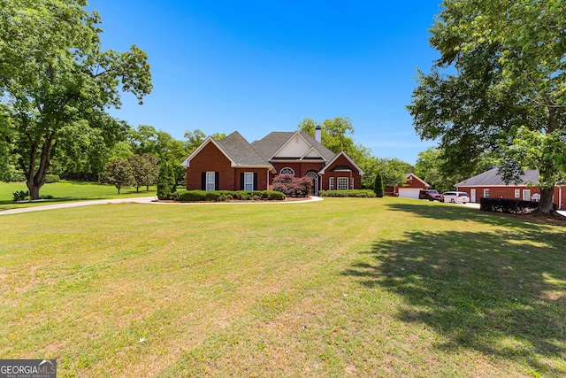 125 Lake Park Dr, Sharpsburg, GA 30277 - traditional-style home with a front lawn and a chimney