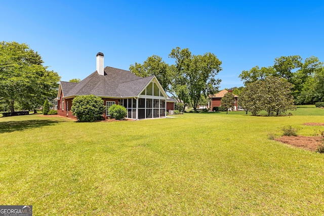 125 Lake Park Dr, Sharpsburg, GA 30277 - view of grassy yard with a sunroom