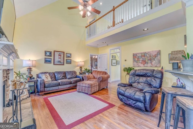 211 Westwood Dr, Calhoun, GA 30701 - living area featuring ceiling fan, a towering ceiling, wood finished floors, and a fireplace