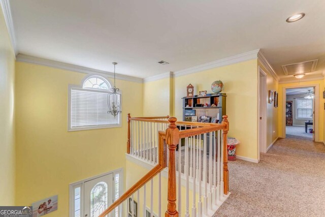 211 Westwood Dr, Calhoun, GA 30701 - hall featuring attic access, an upstairs landing, light carpet, ornamental molding, and baseboards
