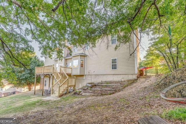 211 Westwood Dr, Calhoun, GA 30701 - back of house with stairway and a deck