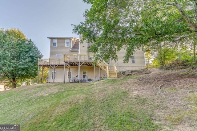 211 Westwood Dr, Calhoun, GA 30701 - back of house with a deck, a lawn, and stairs