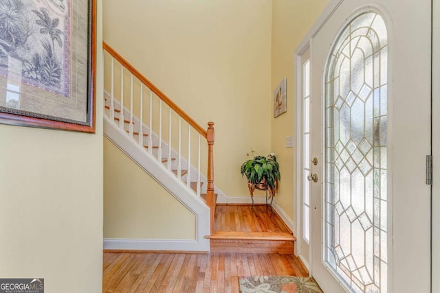 211 Westwood Dr, Calhoun, GA 30701 - entryway featuring hardwood / wood-style flooring, stairs, healthy amount of natural light, and baseboards