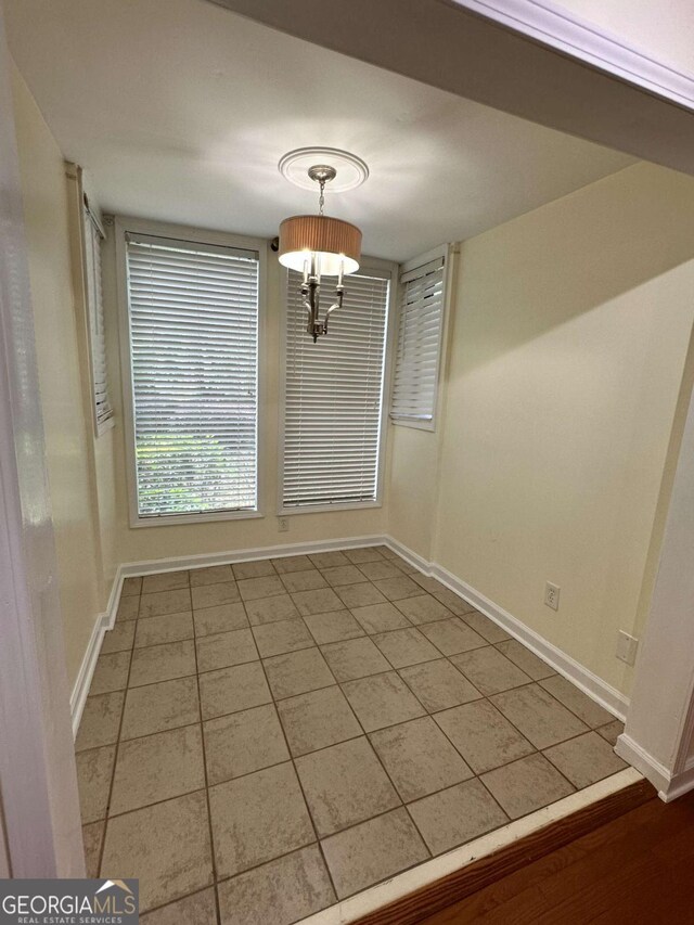1503 Wingate Way Unit 1503, Sandy Springs, GA 30350 - unfurnished dining area with baseboards and tile patterned floors