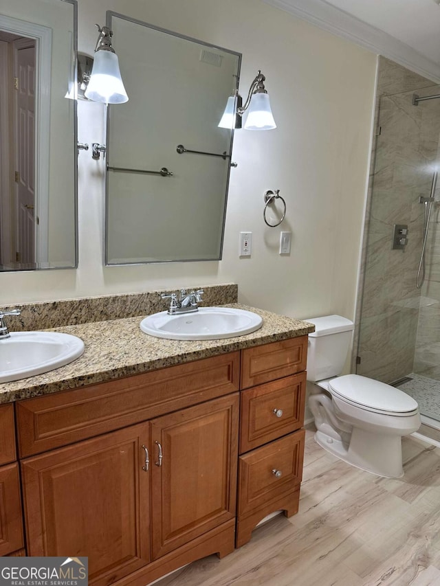 1503 Wingate Way Unit 1503, Sandy Springs, GA 30350 - full bath featuring a shower stall, double vanity, toilet, wood finished floors, and ornamental molding