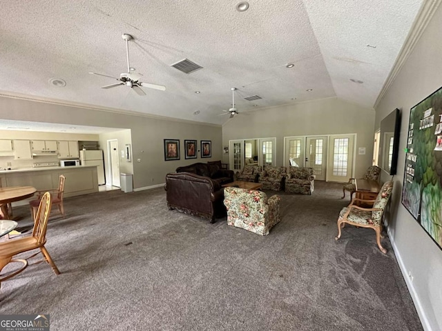 1503 Wingate Way Unit 1503, Sandy Springs, GA 30350 - living area featuring vaulted ceiling, crown molding, ceiling fan, dark carpet, and baseboards
