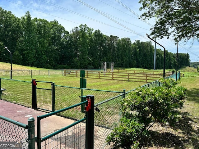 1503 Wingate Way Unit 1503, Sandy Springs, GA 30350 - view of yard featuring a dog friendly area, a gate, and a view of countryside