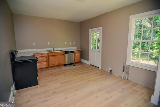 109 C St SE, Thomaston, GA 30286 - kitchen featuring stainless steel dishwasher, electric range, light countertops, light wood finished floors, and healthy amount of natural light