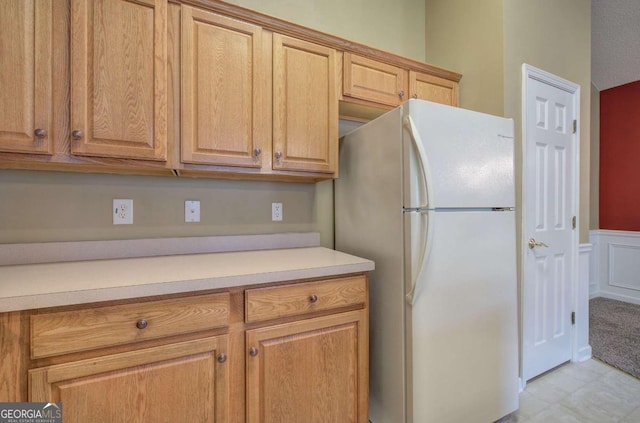 580 Camry Cir, Dallas, GA 30157 - kitchen with freestanding refrigerator, light countertops, and wainscoting