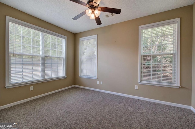 580 Camry Cir, Dallas, GA 30157 - empty room with carpet flooring, healthy amount of natural light, ceiling fan, and a textured ceiling