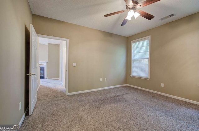 580 Camry Cir, Dallas, GA 30157 - unfurnished room with carpet, a ceiling fan, baseboards, and a textured ceiling