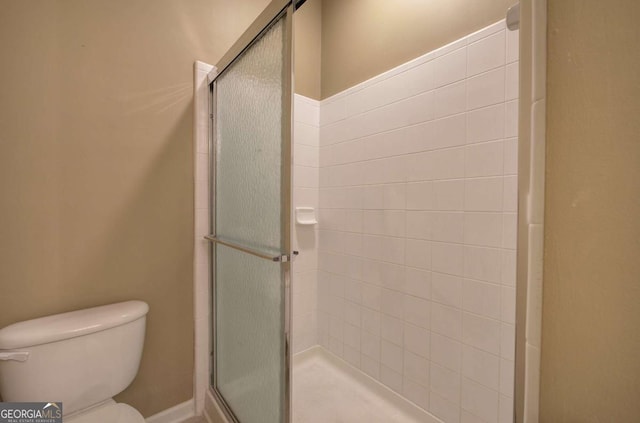 580 Camry Cir, Dallas, GA 30157 - bathroom featuring a stall shower and toilet