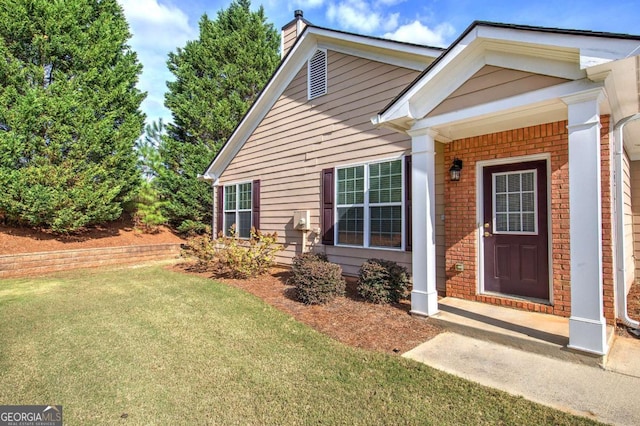 580 Camry Cir, Dallas, GA 30157 - view of front of property with a front lawn, brick siding, and a chimney