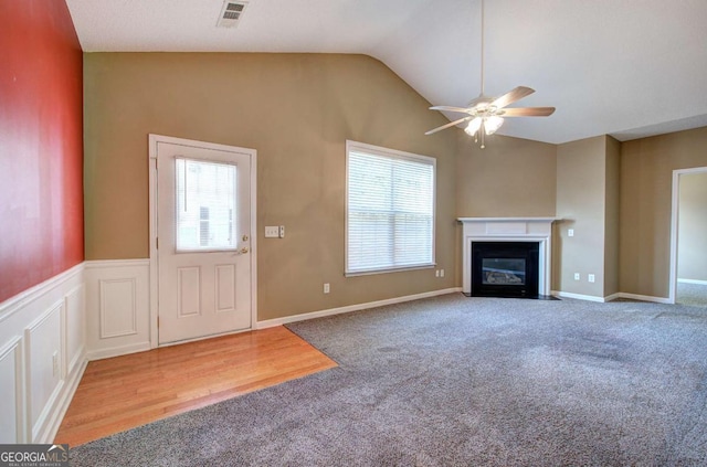 580 Camry Cir, Dallas, GA 30157 - unfurnished living room featuring ceiling fan, carpet flooring, lofted ceiling, and a fireplace with flush hearth