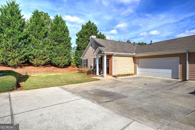 580 Camry Cir, Dallas, GA 30157 - view of front of property with concrete driveway, a front yard, a garage, a chimney, and roof with shingles