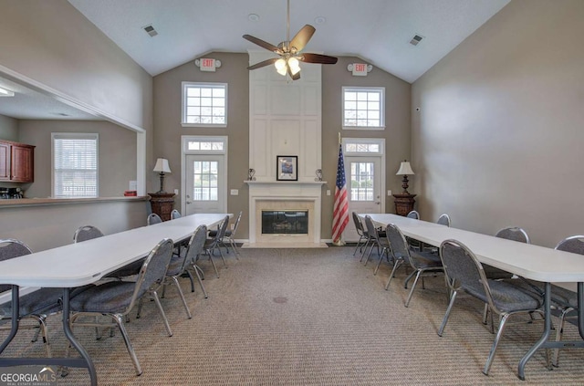 580 Camry Cir, Dallas, GA 30157 - dining room featuring high vaulted ceiling, a ceiling fan, a fireplace, and light carpet