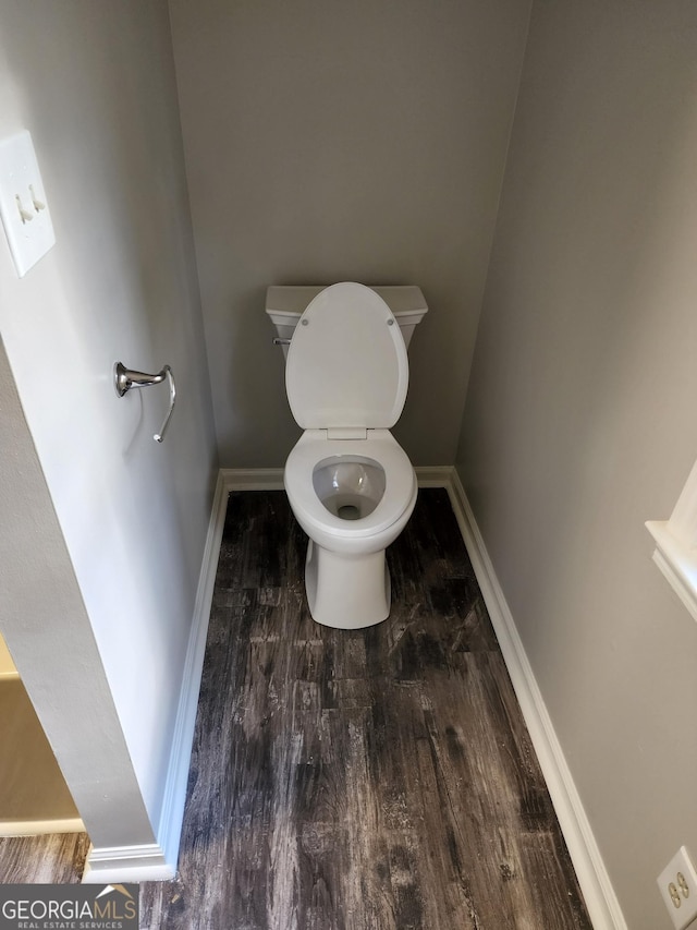 125 Toccoa Rd, Carrollton, GA 30116 - bathroom with wood finished floors, toilet, and baseboards