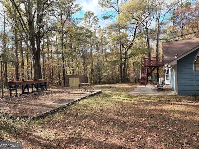 125 Toccoa Rd, Carrollton, GA 30116 - view of yard with stairs, a patio area, and a wooden deck