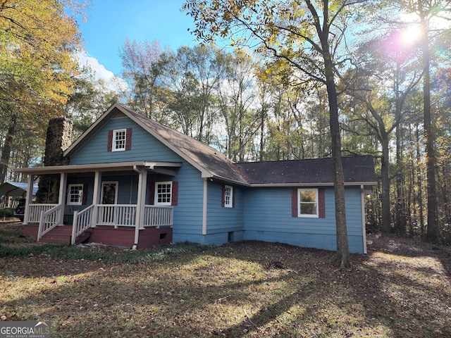 125 Toccoa Rd, Carrollton, GA 30116 - view of front of home with covered porch, crawl space, and a chimney