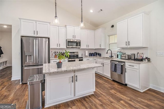 461 Barnwood, Rockmart, GA 30153 - kitchen with stainless steel appliances, a sink, white cabinetry, lofted ceiling, and recessed lighting