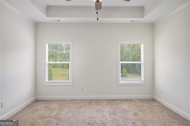461 Barnwood, Rockmart, GA 30153 - empty room featuring a tray ceiling, a ceiling fan, light colored carpet, ornamental molding, and baseboards