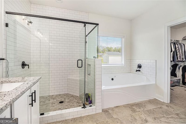 461 Barnwood, Rockmart, GA 30153 - full bath featuring a bath, a shower stall, a walk in closet, and vanity