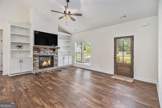 461 Barnwood, Rockmart, GA 30153 - unfurnished living room featuring dark wood-type flooring, baseboards, a stone fireplace, lofted ceiling, and built in features