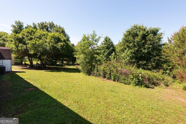 35 Good Hope Rd, Colbert, GA 30628 - view of grassy yard with central AC