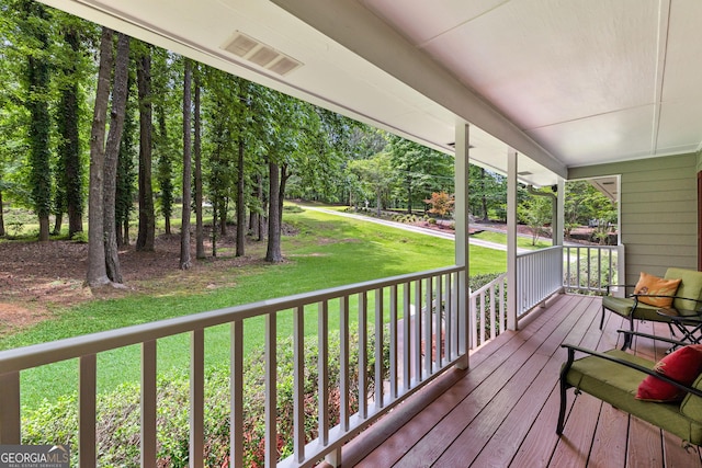 145 Adams Ct, Fayetteville, GA 30214 - wooden porch featuring a lawn